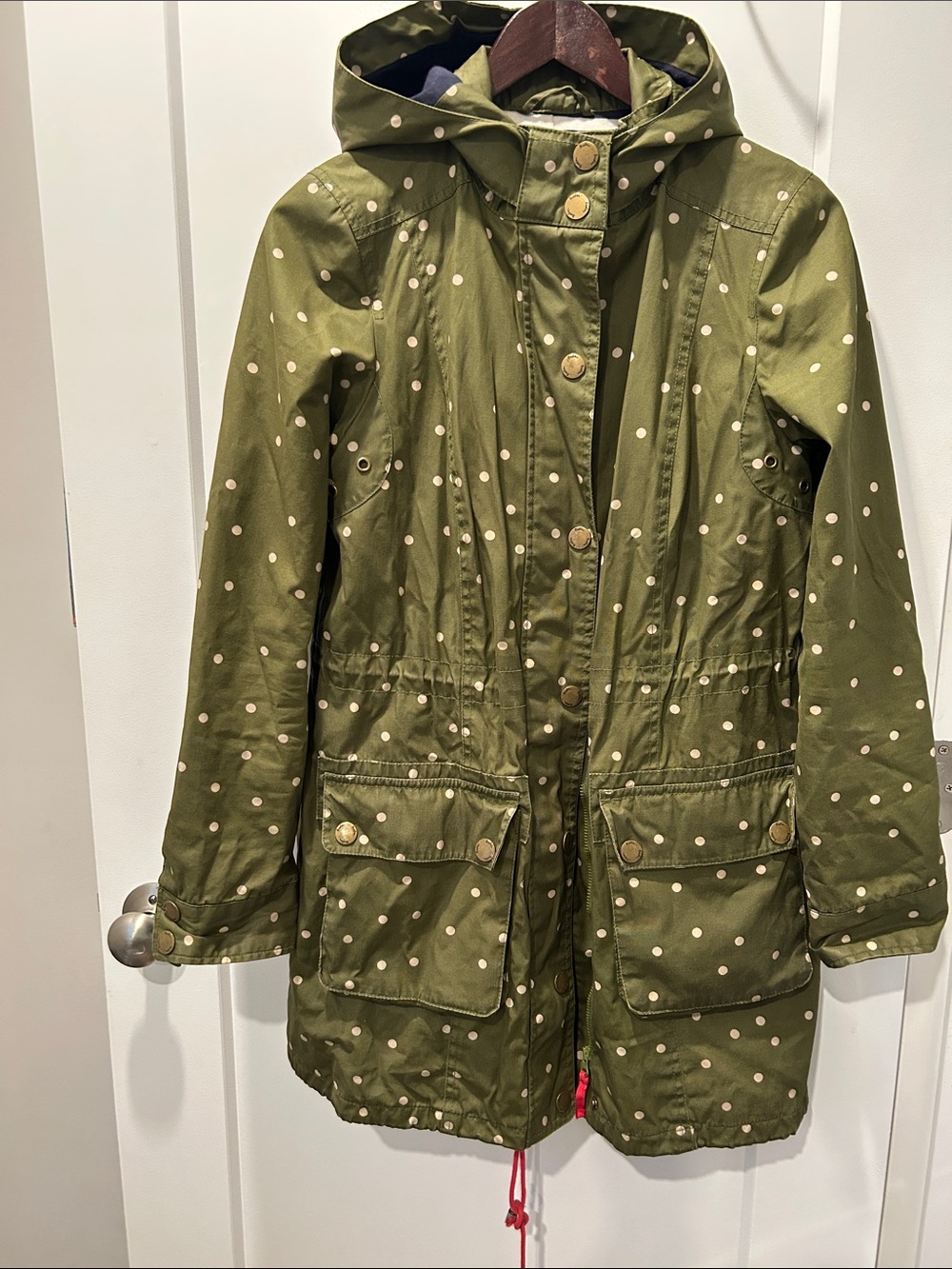 Boden hooded green and white polka dot rain jacket size 6